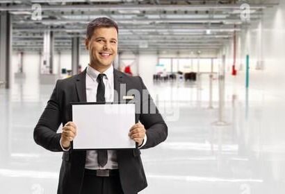 man-waiting-a-passenger-at-an-airport-with-a-name-board-2fnr368.jpg